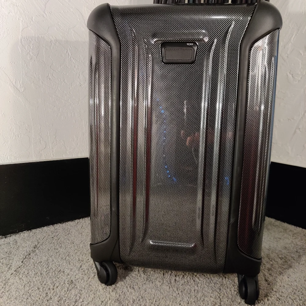 Tumi •upgrade your